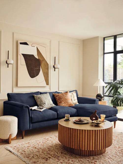 creme livingroom with brown and dark blue accents